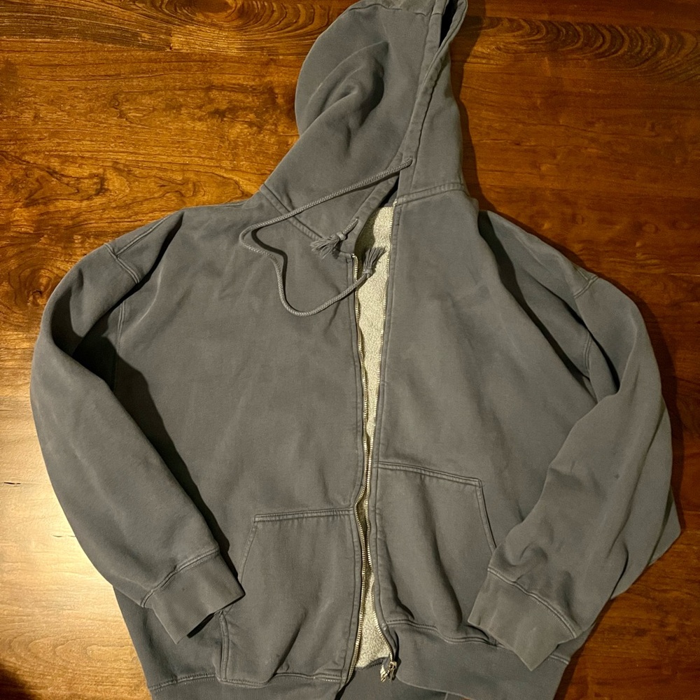 Oversized blue/gray hoodie.